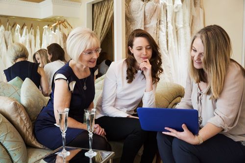 three-women-in-a-wedding-dress-shop-one-bride-to-2022-03-04-02-13-27-utc.jpg